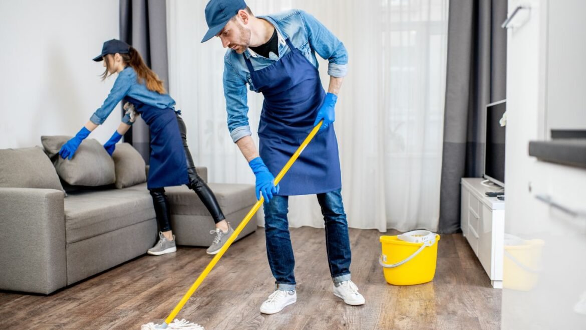 Premium villa cleaning service team disinfecting kitchen and bathroom surfaces.