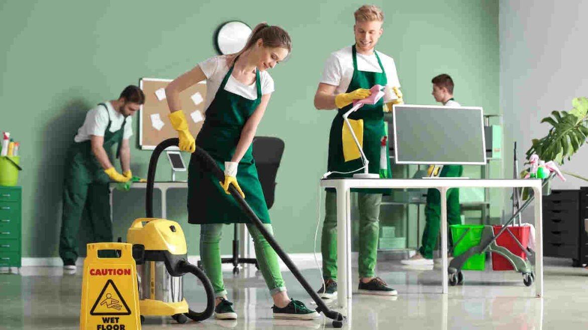 Team providing deep office cleaning service in Bin Zayed City workspace