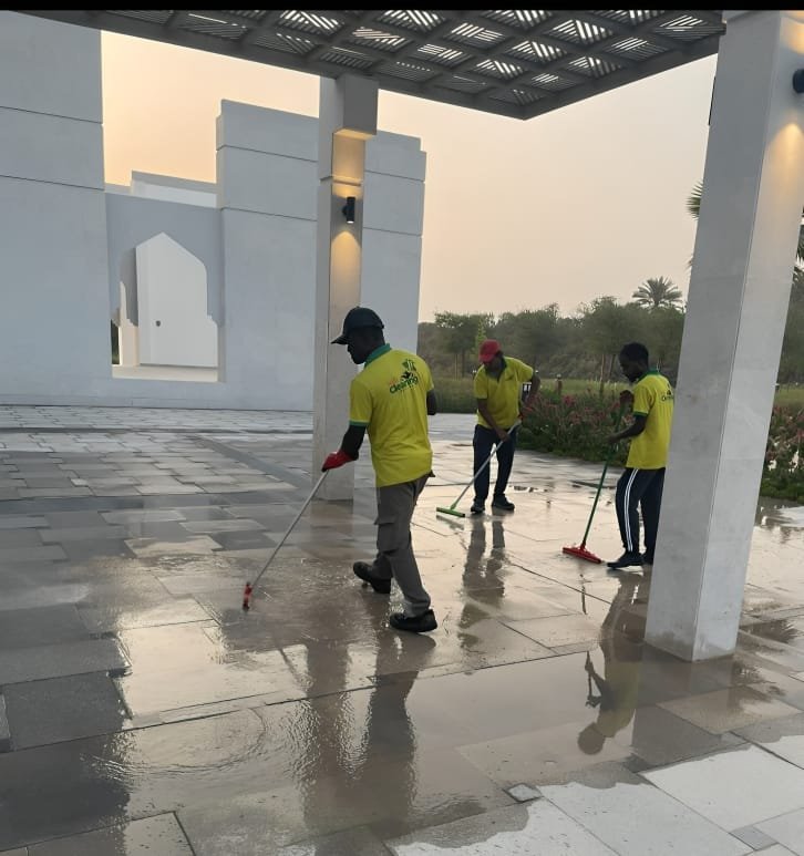 Trained staff delivering villas professional cleaning service in modern Abu Dhabi home.