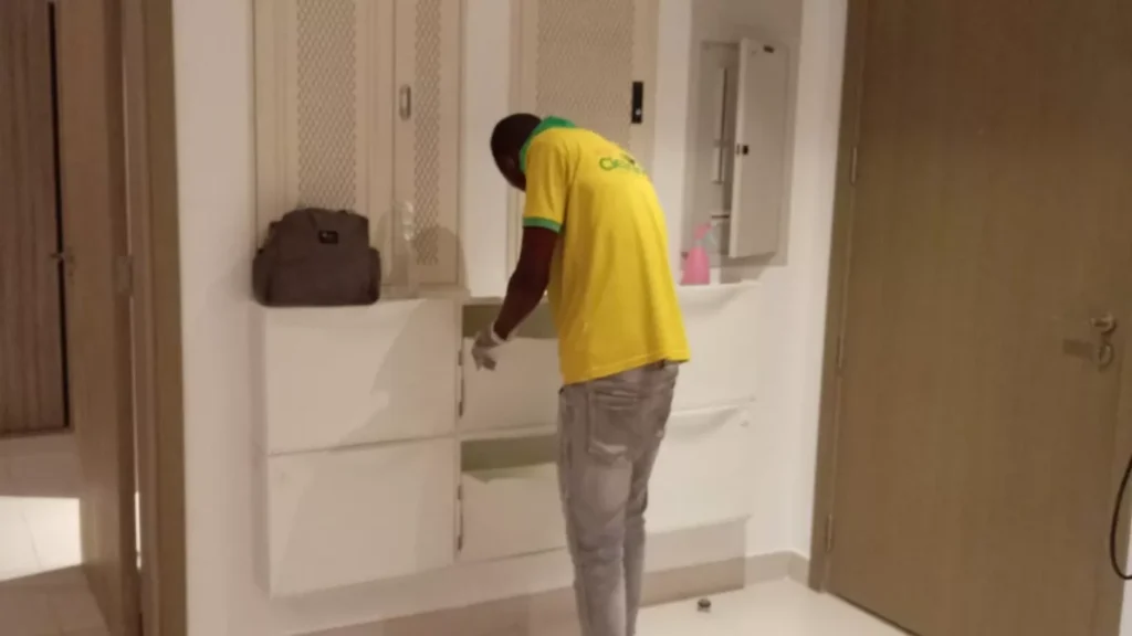 Kitchen degreasing process during villa deep cleaning